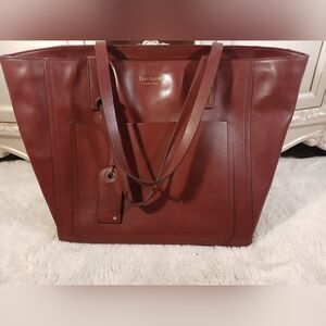 Kate Spade Lalena large smooth leather pocket tote in a blackberry red/ Maroon
